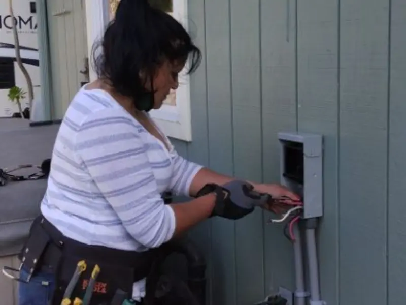 Licensed electrician wiring an exterior subpanel in Benicia